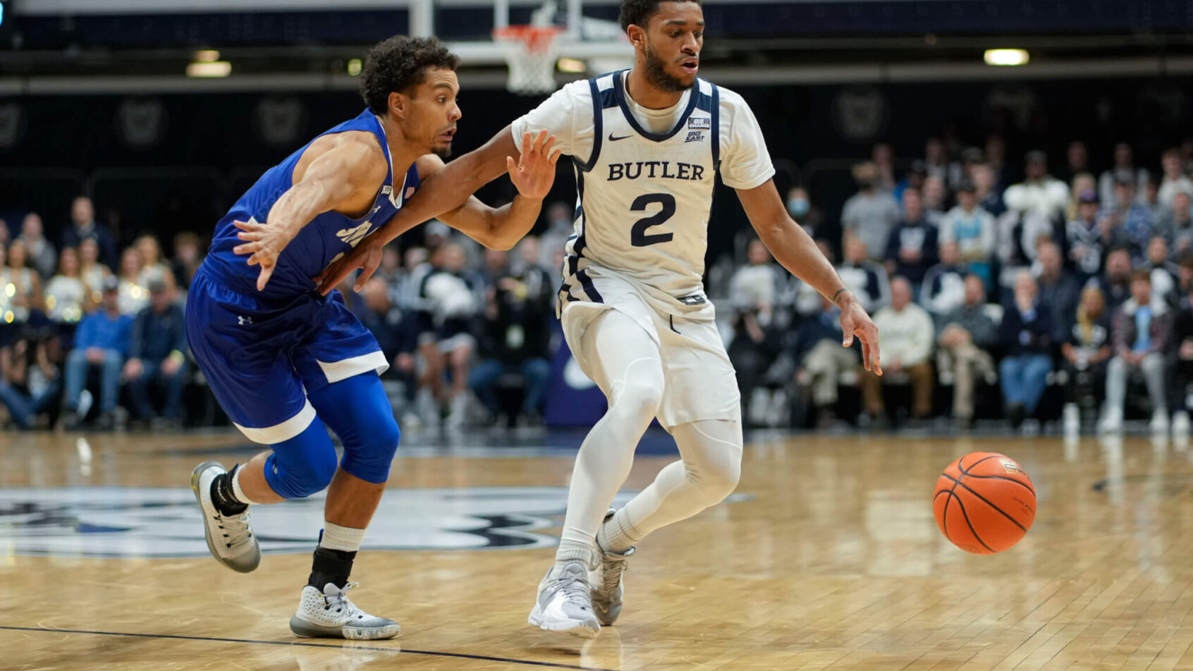 Butler guard Aaron Thompson dribbling around a defender