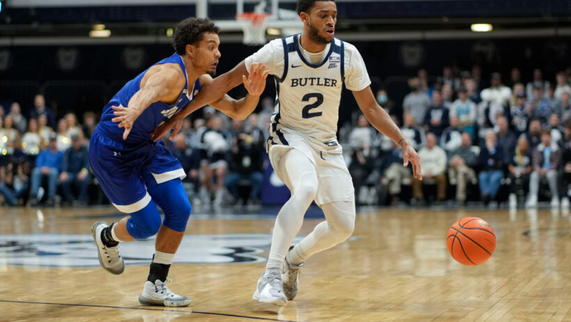 Butler guard Aaron Thompson dribbling around a defender