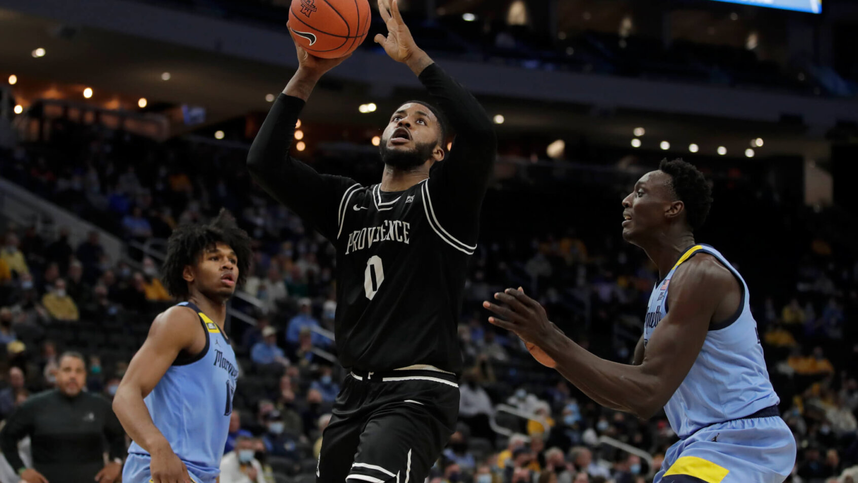 Providence's Nate Watson shooting a floater.