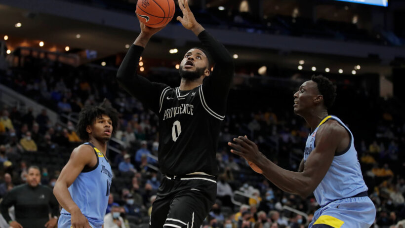Providence's Nate Watson shooting a floater.
