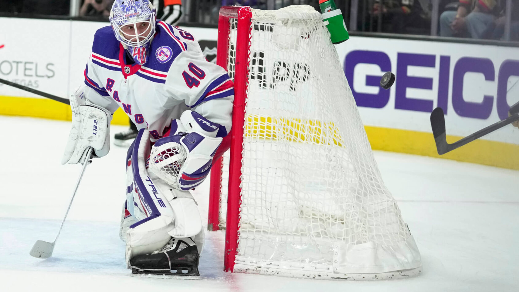 New York Rangers goaltender Alexander Georgiev defending the net during an NHL game,