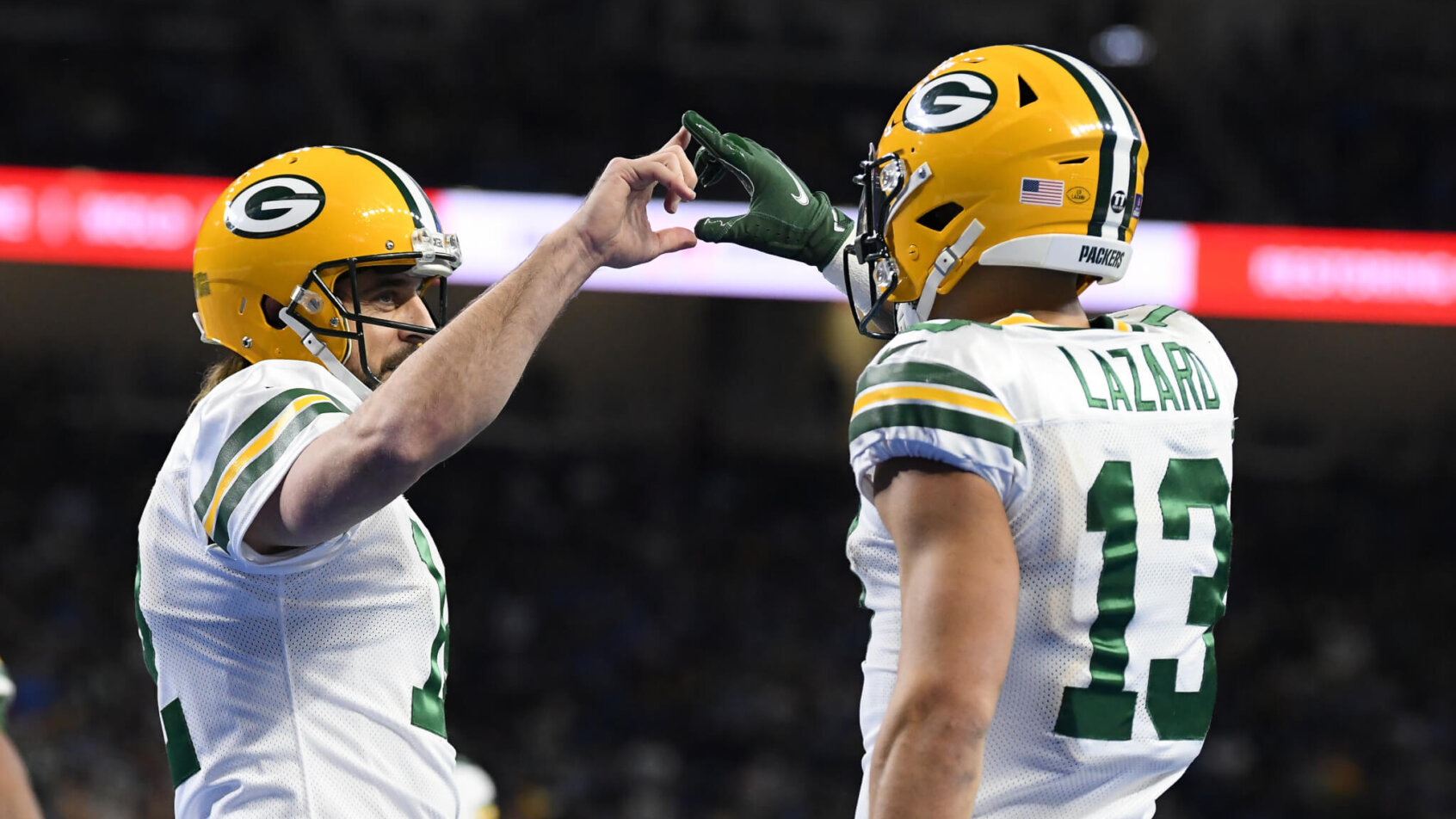 Aaron Rodgers touches hands with Alan Lazard in TD celebration