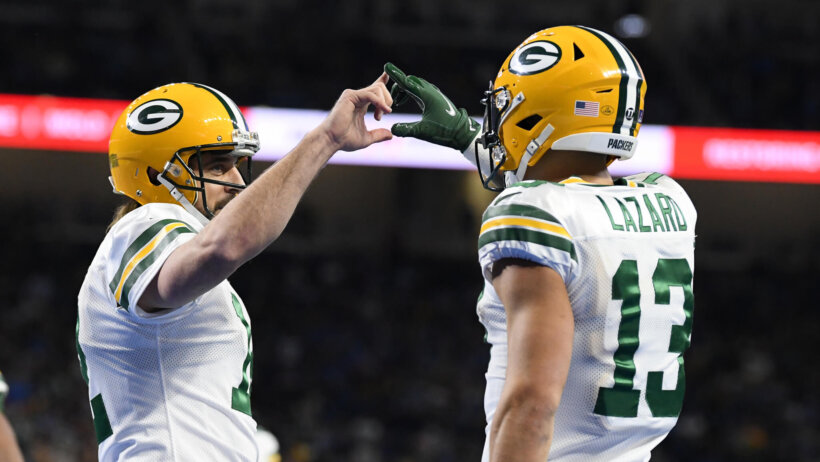 Aaron Rodgers touches hands with Alan Lazard in TD celebration