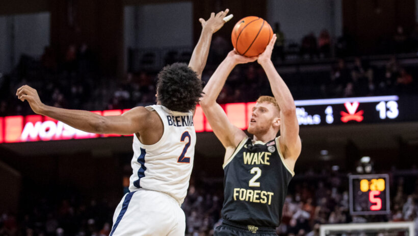 Virginia guard Reece Beekman shooting over a defender
