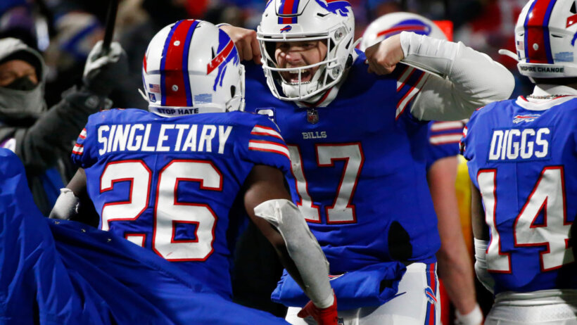 Josh Allen flexing and celebrating with Devin Singletary