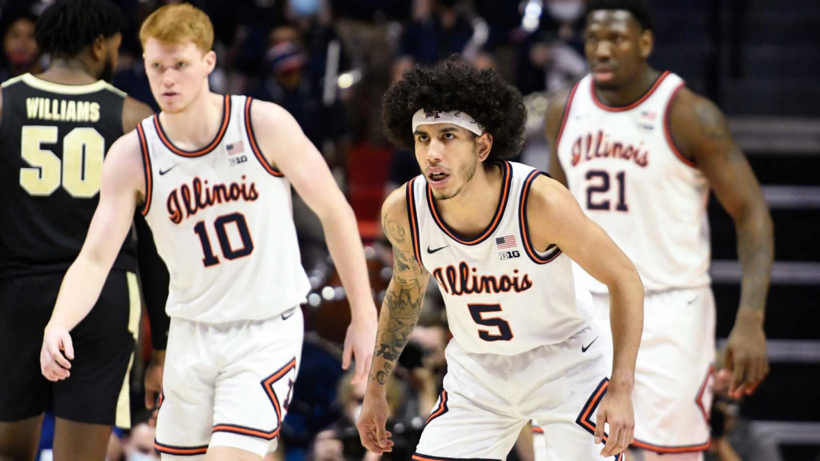Illinois's Andre Curbelo, Luke Goode and Kofi Cockburn on the court