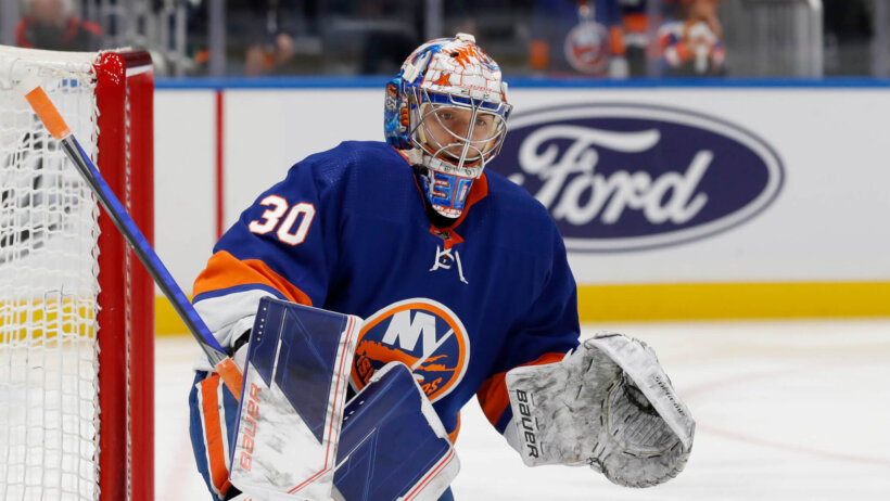 New York Islanders goaltender Ilya Sorokin preparing in front of the net prior to a game.