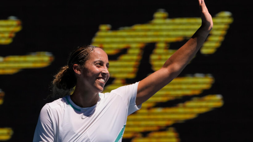 Madison Keys waving to the crowd after winning a match at the 2022 Australian Open.