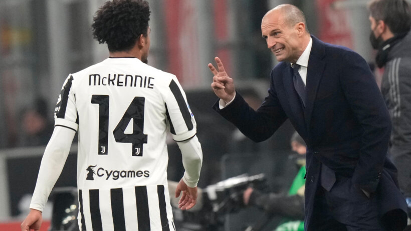 Juventus' head coach Massimillano Allegri talking with his player during a soccer match.