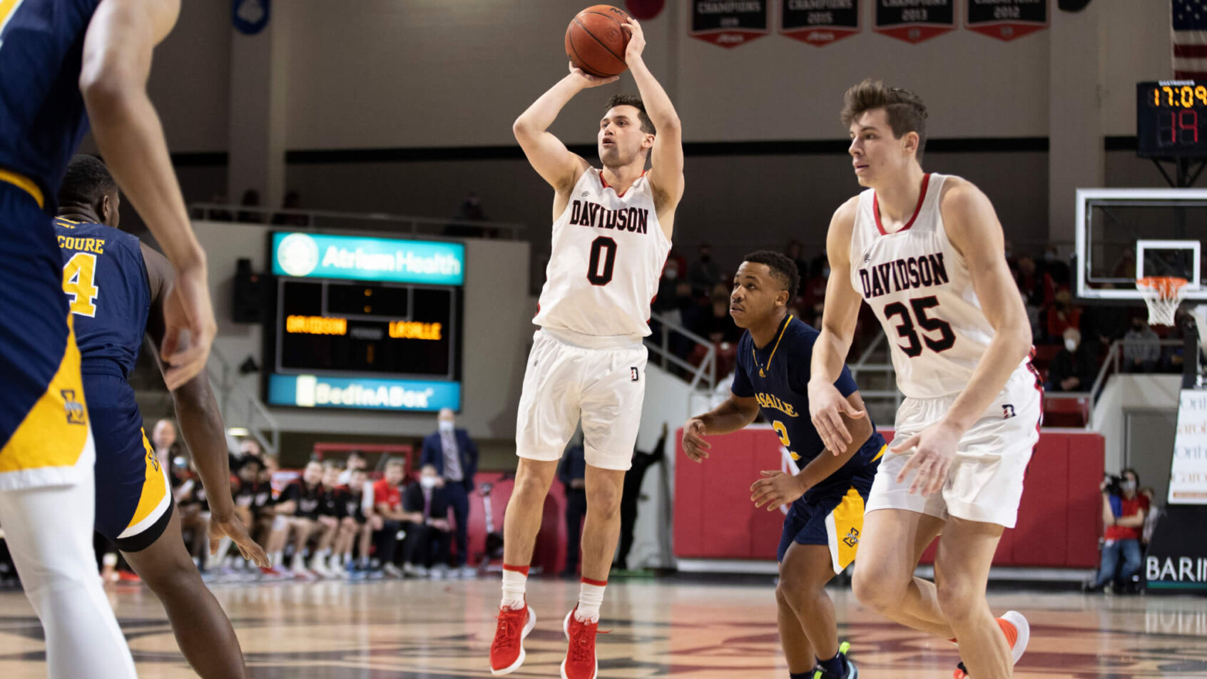 Davidson guard Foster Loyer shooting a three