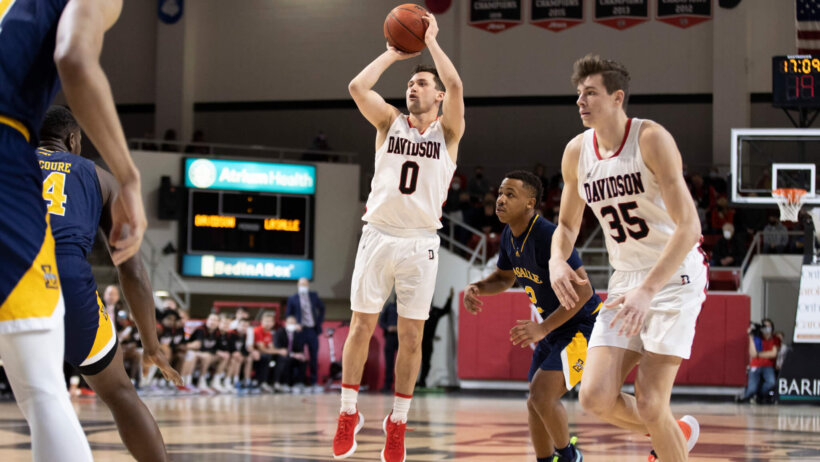 Davidson guard Foster Loyer shooting a three