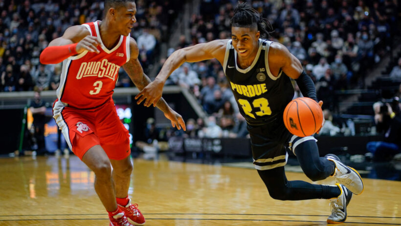 Purdue guard Jaden Ivey dribbling by a defender