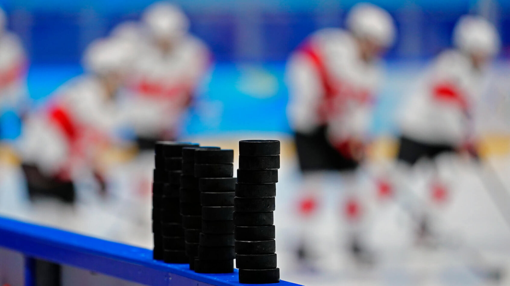 Pucks stacked pre-game, Ice Hockey 2022 Beijing Olympics