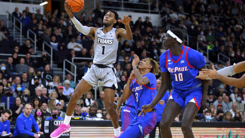 Providence's Al Durham scoring a layup