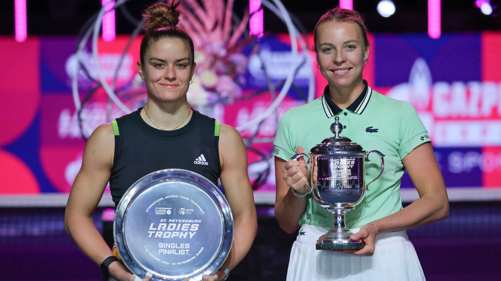 Maria Sakkari and Anett Kontaveit posing with their trophies after a final match.
