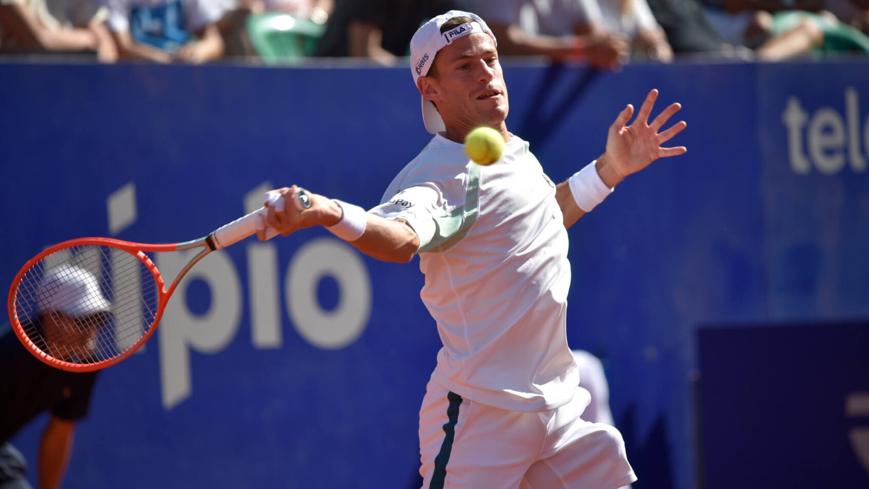 Diego Schwartzman hitting a forehand return during a match.