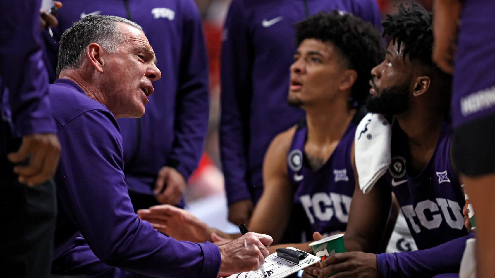 TCU coach Jamie Dixon talking to him team during a timeout