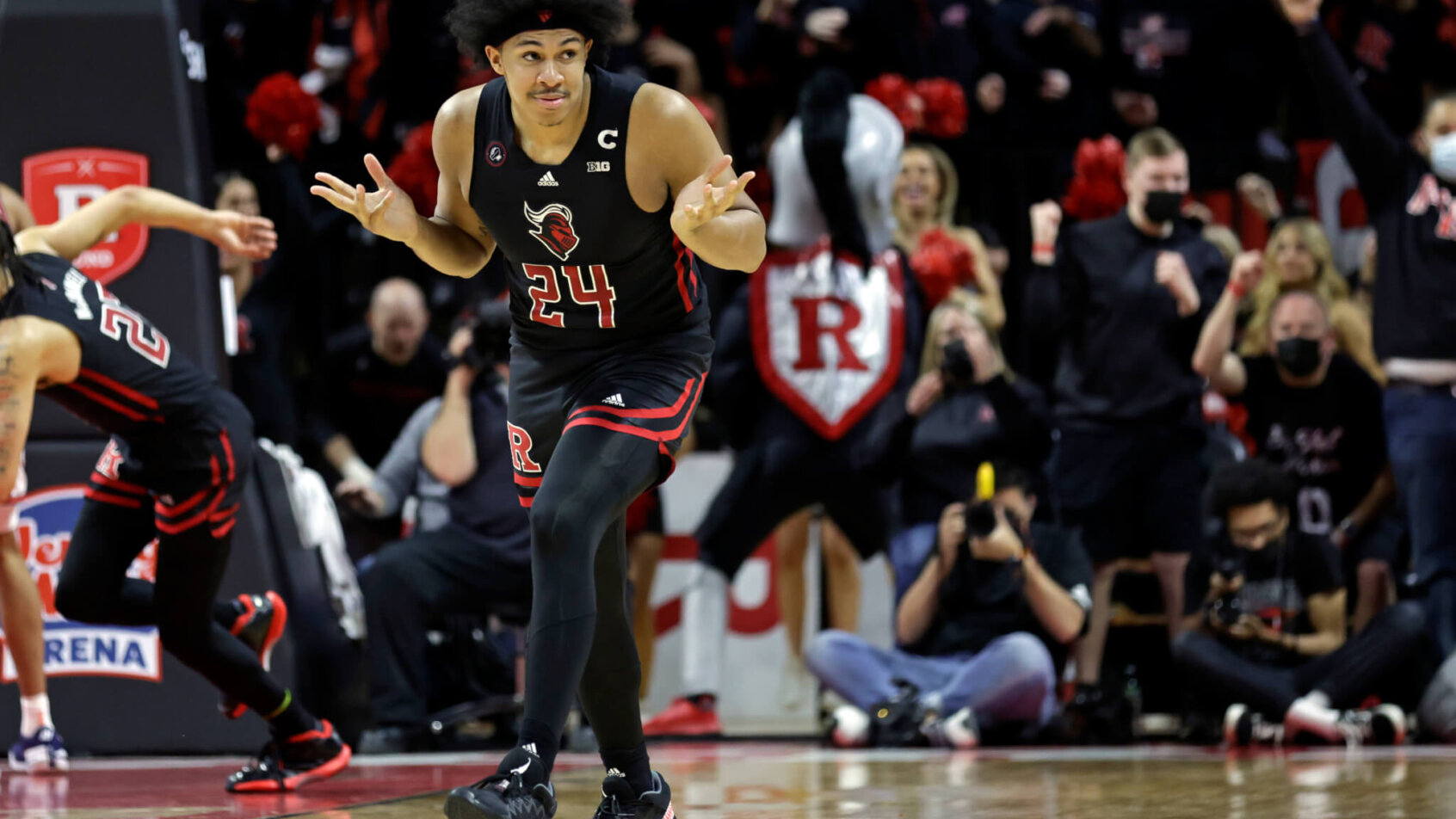 Rutgers forward Ron Harper Jr smiling on the court