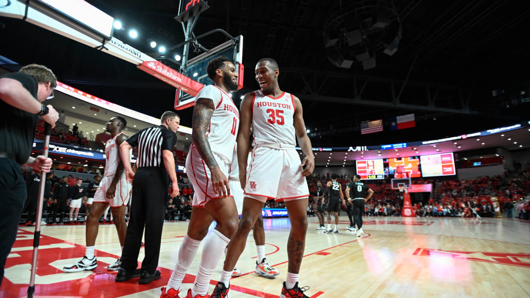 Houston Cougars teammates react to a foul call