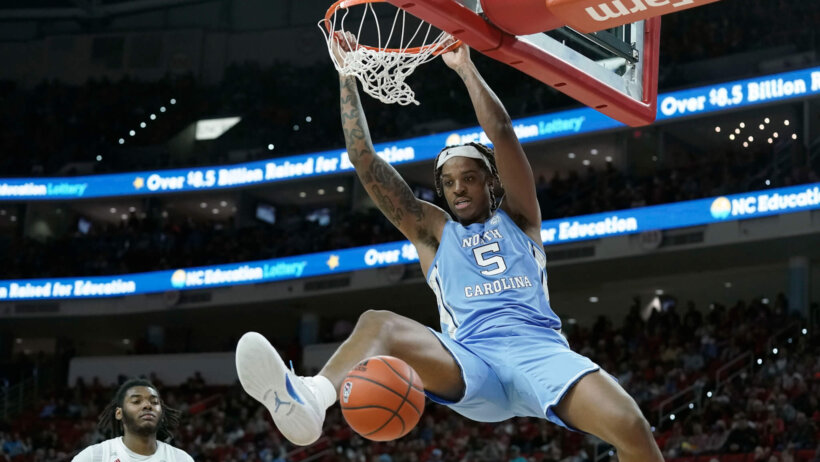 Armando Bacot dunking basketball