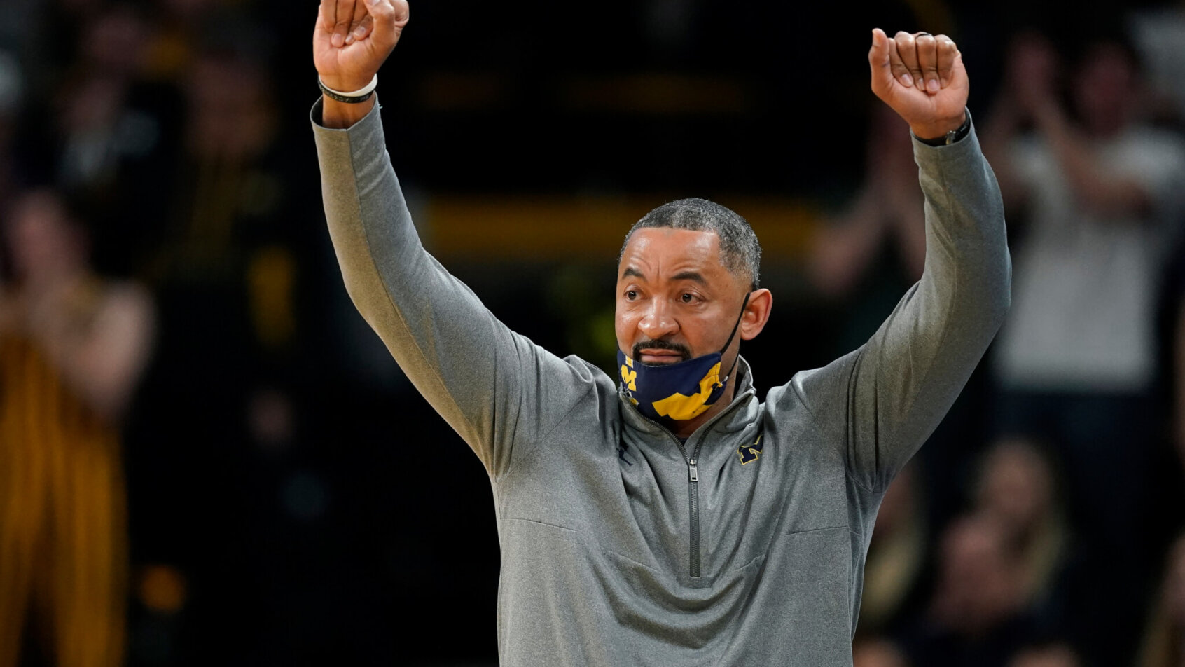 Michigan head coach Juwan Howard signaling to his team