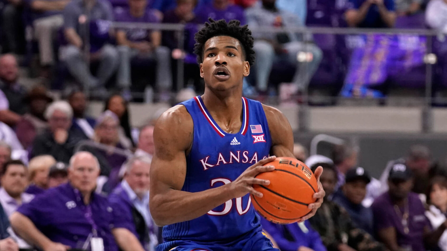 Ochai Agbaji prepares to shoot basketball