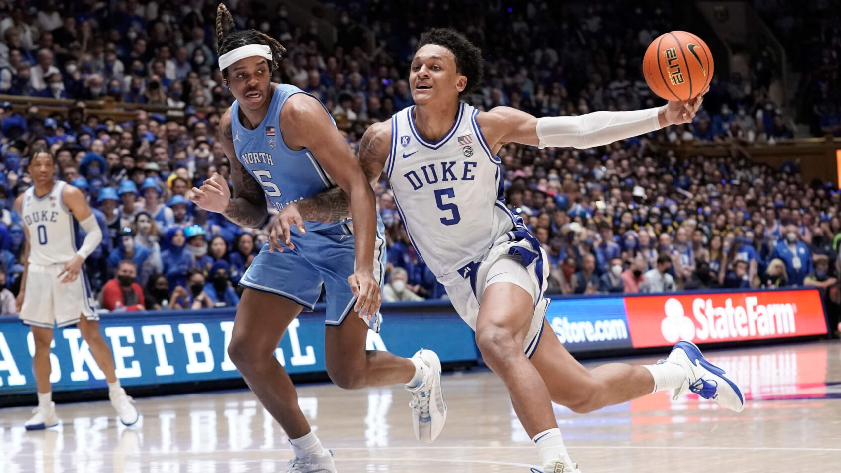 Duke forward Paolo Banchero past UNC's Armando Bacot
