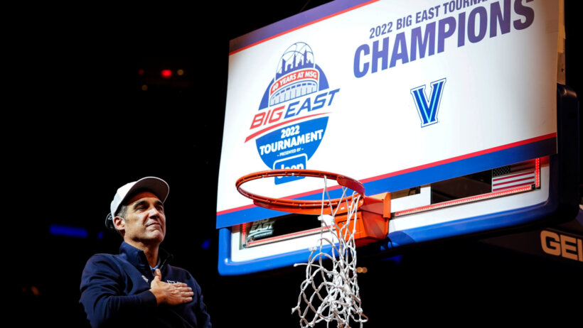 Villanova head coach Jay Wright cutting down the nets after winning the 2022 Big East Tournament