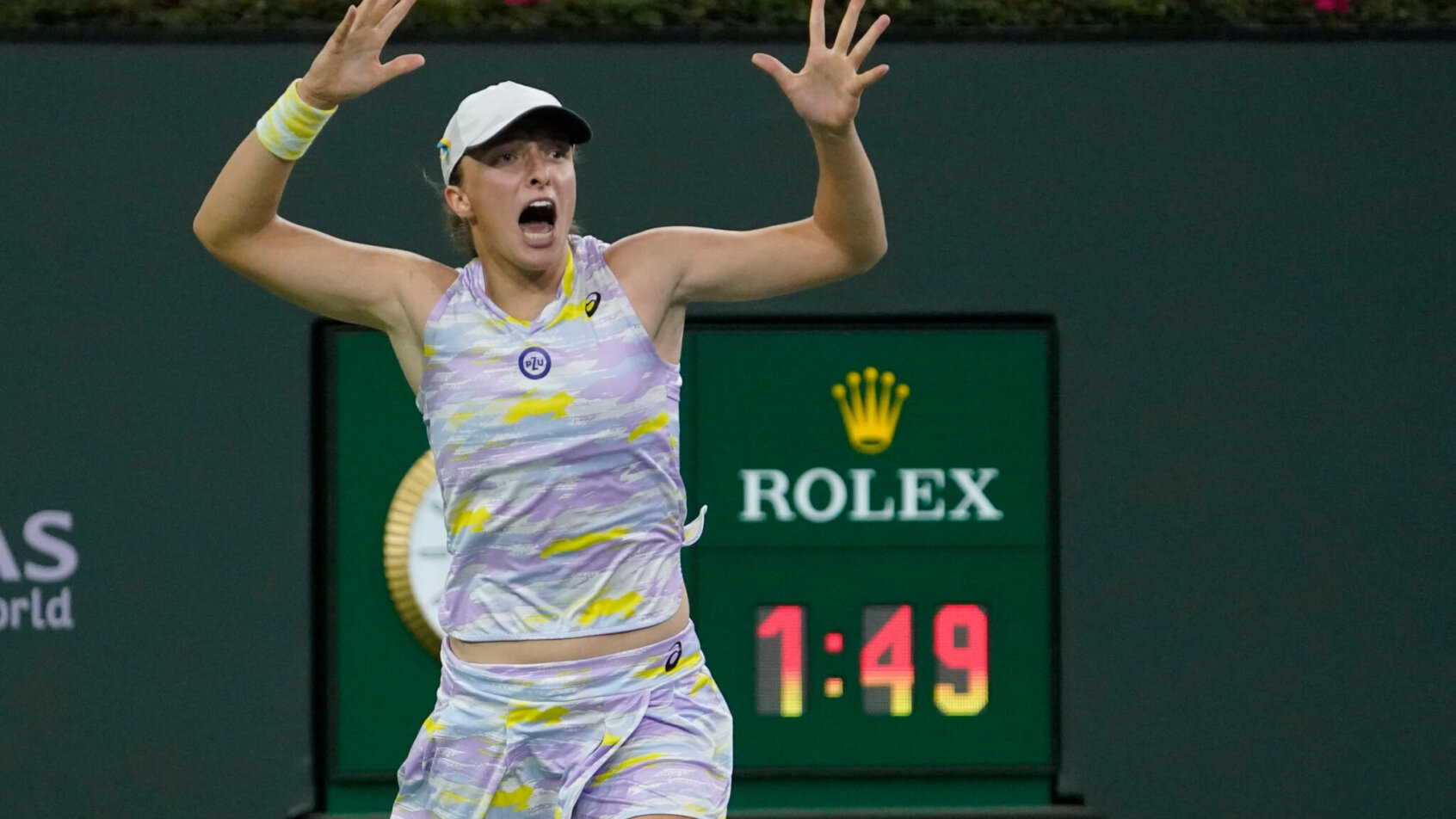 Iga Swiatek reacts to winning