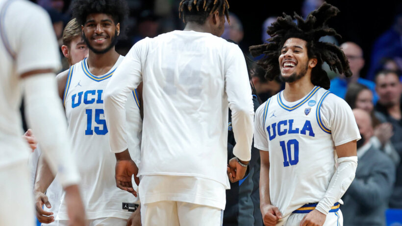 UCLA guard Tyger Campbell celebrating with teammates