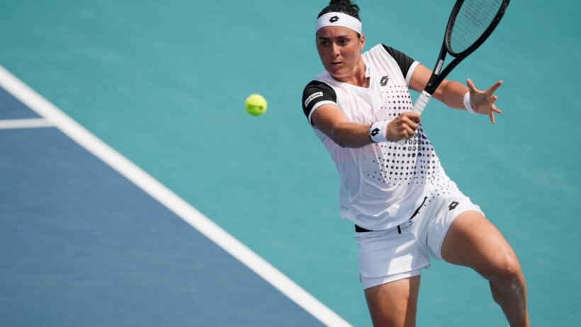 Ons Jabeur hitting a return during a tennis match at the Miami Open.