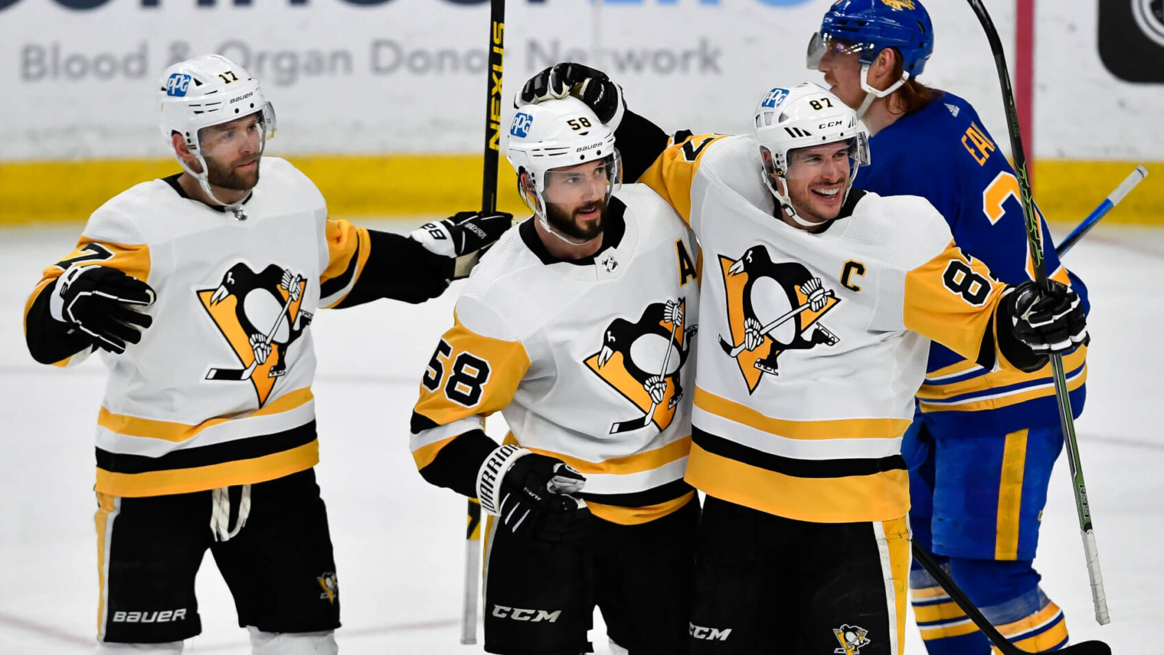 Penguins players celebrate goal