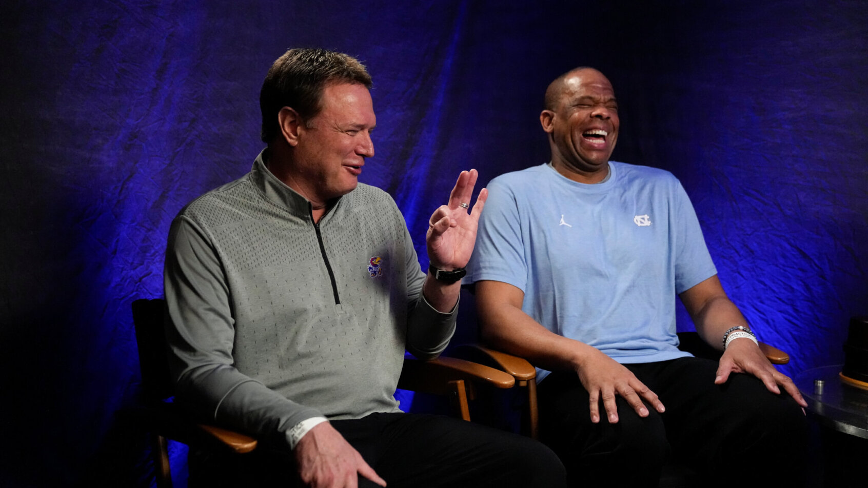 Kansas head coach Bill Self and North Carolina head coach Hubert Davis doing an interviews