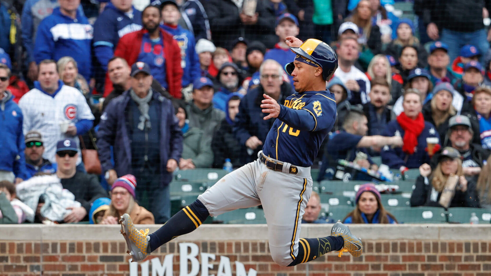 Milwaukee Brewers' Kolten Wong sliding into home