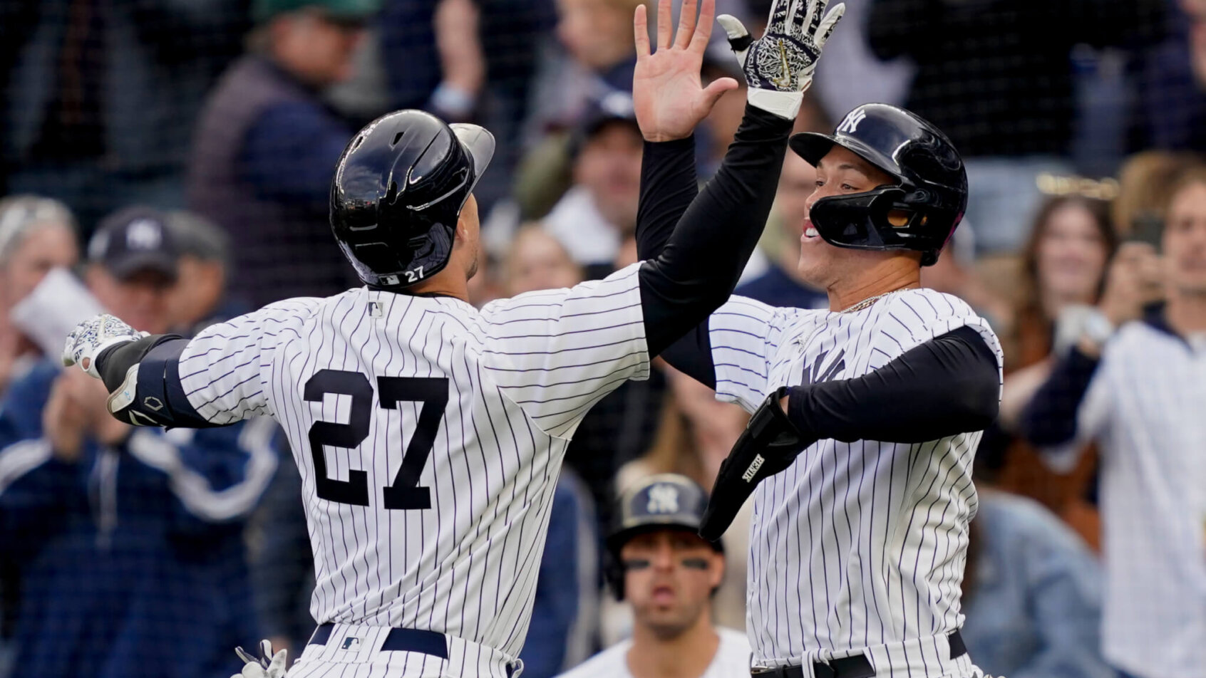 Giancarlo Stanton celebrates with Aaron Judge
