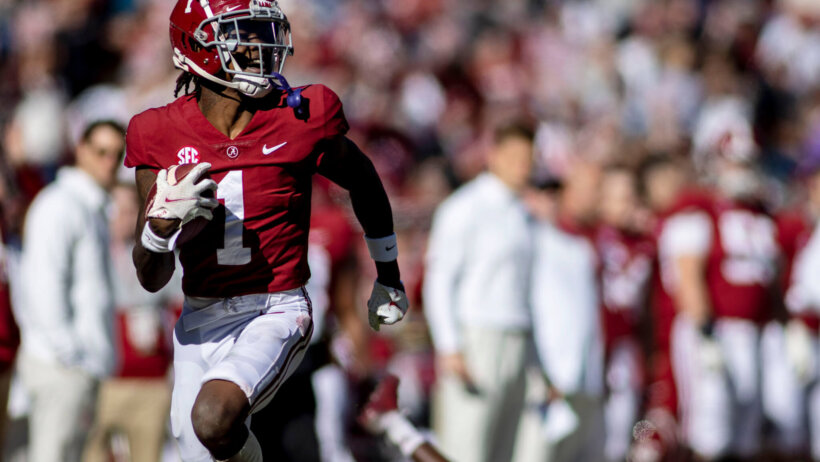 Jameson Williams running away from defenders