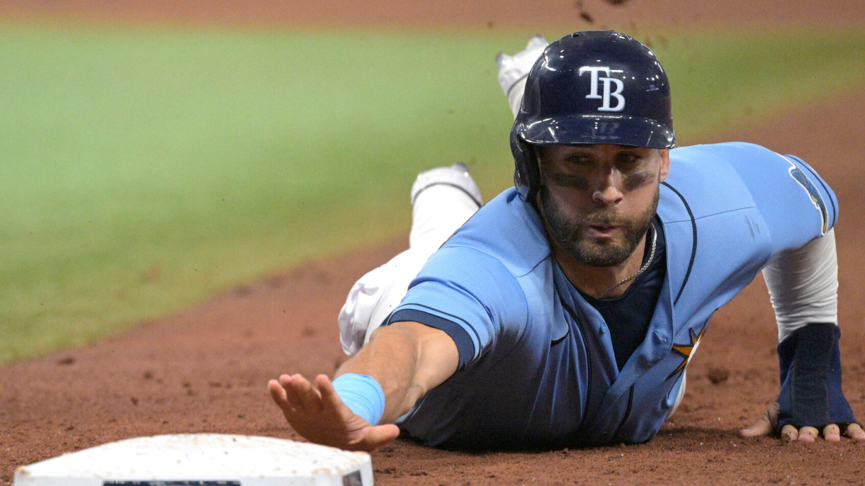 Kevin Kiermaier sliding back to first base on a pickoff attempt.