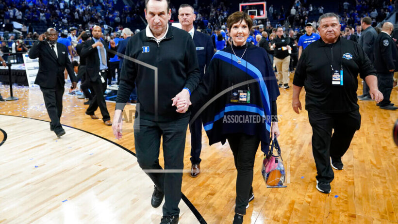 Duke head coach Mike Krzyzewski walking off the court after his team beat Saint Peter's