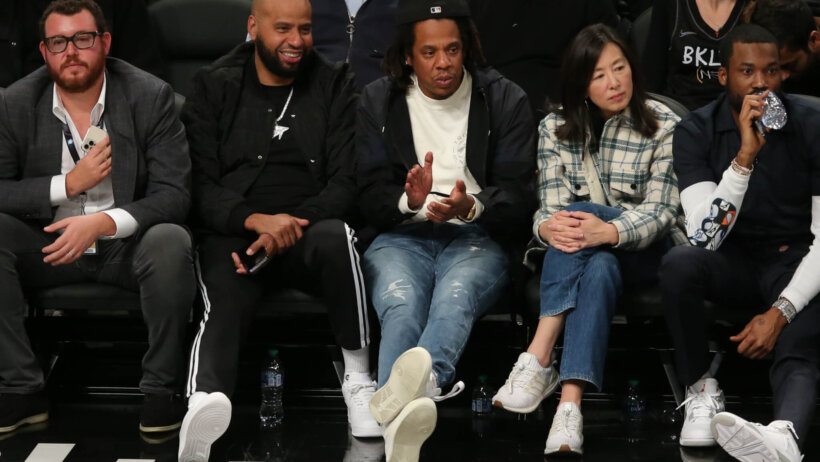 jay z sitting courtside at a basketball game