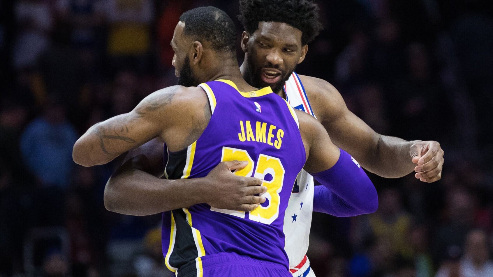 LeBron James and Joel Embiid hug