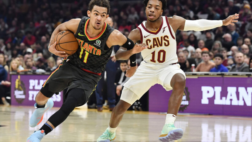 Trae Young drives on Darius Garland