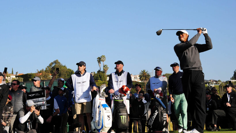 Tiger Woods hits a tee shot