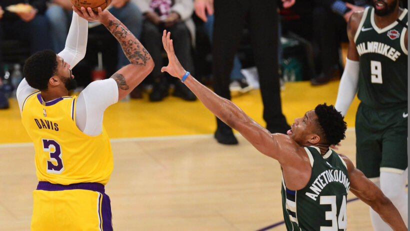 Anthony Davis jumper contested by Giannis Antetokounmpo