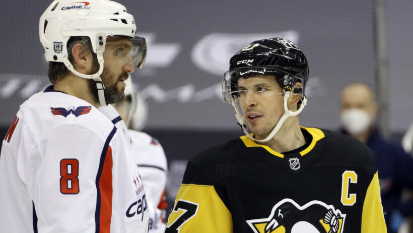 Washington Capitals left wing Alex Ovechkin and Pittsburgh Penguins center Sidney Crosby talk