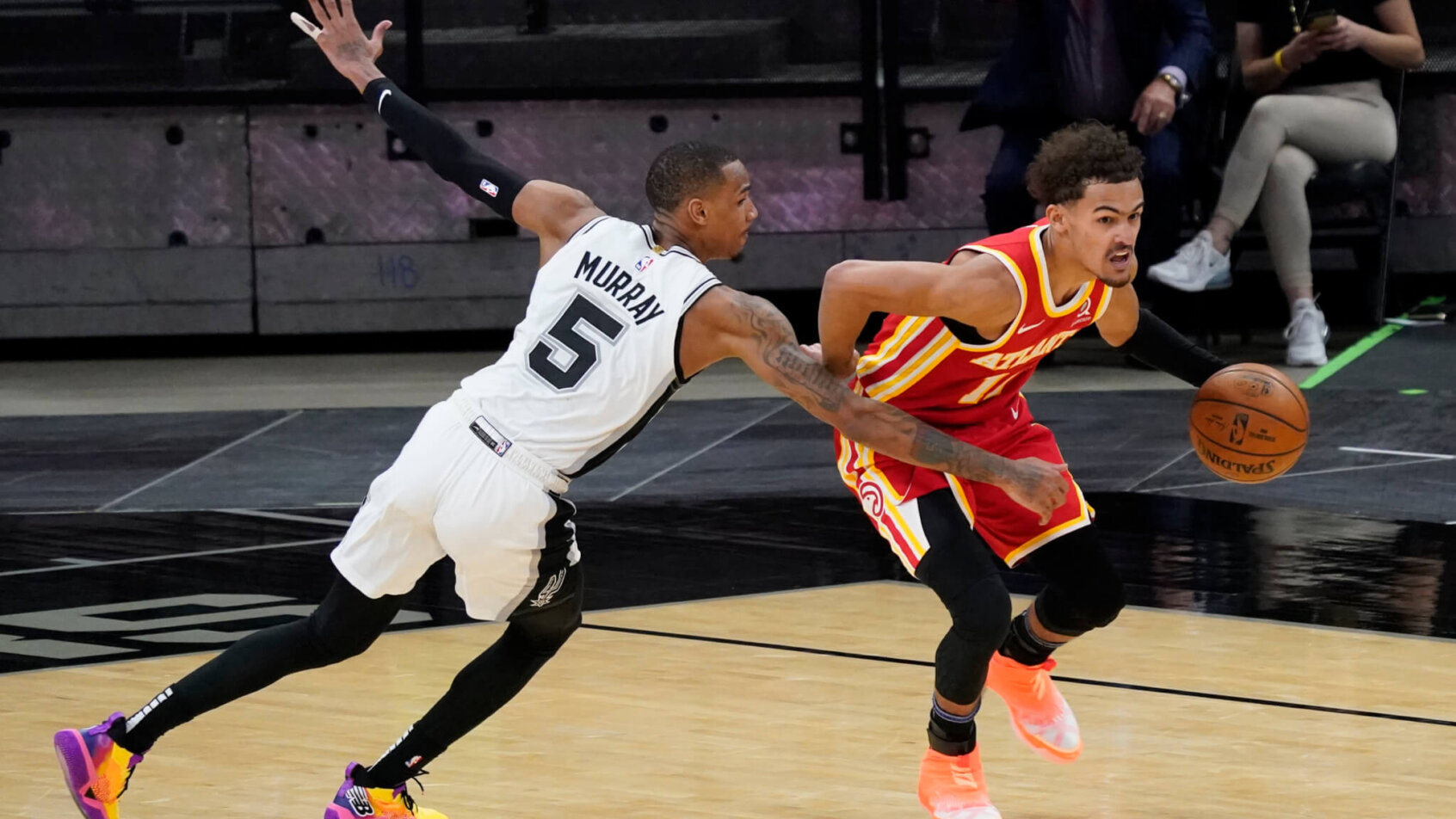 New Hawks teammates Dejounte Murray and Trae Young.