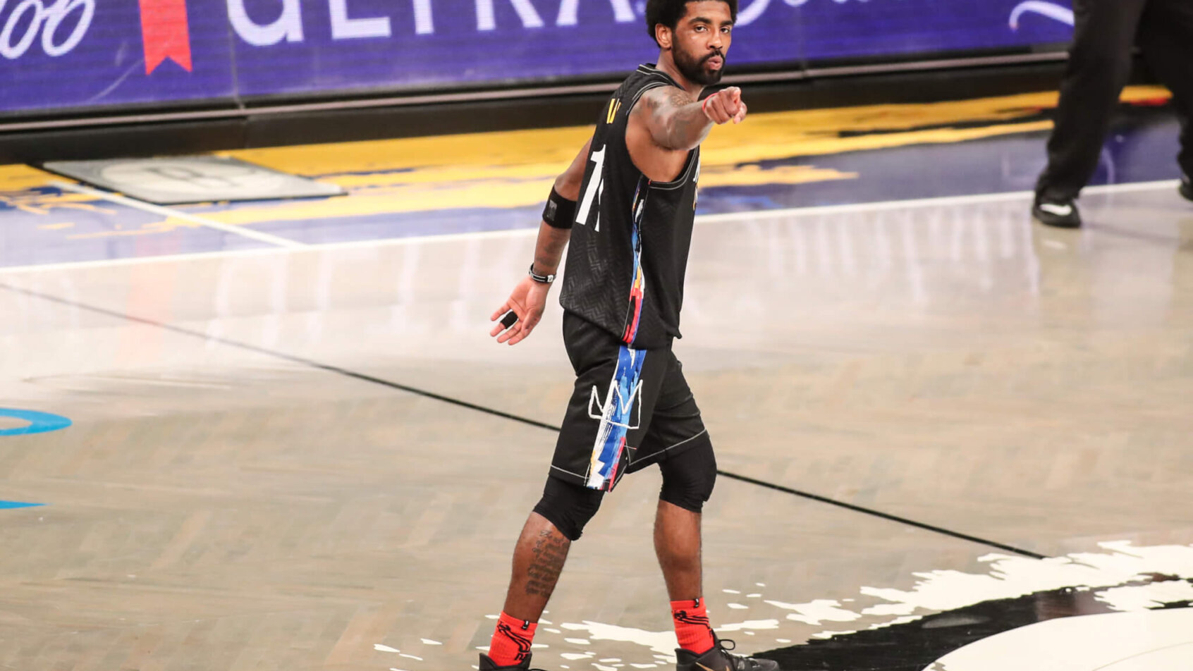 Kyrie Irving points to fan