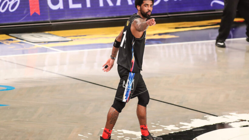 Kyrie Irving points to fan