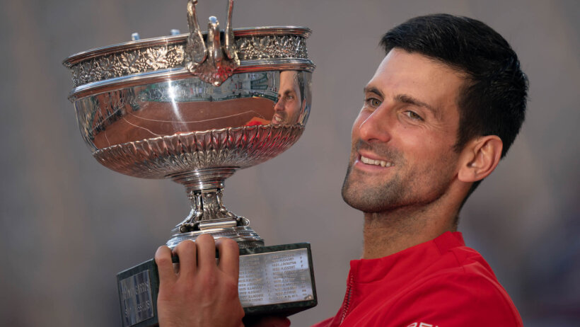 Novak Djokovic holding trophy