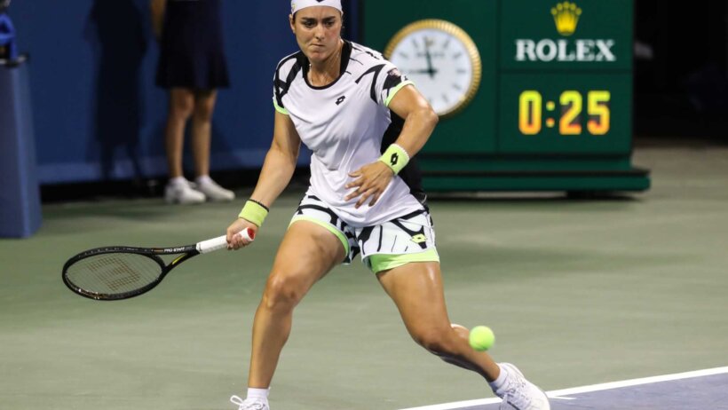 Ons Jabeur gets set to strike a forehand