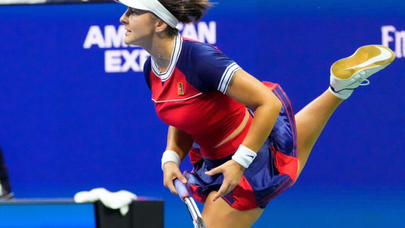 Bianca Andreescu hitting a return during a tennis match.